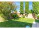 Well-maintained backyard with lush green lawn and tasteful landscaping at 2708 Norbeck St, Las Vegas, NV 89117