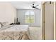 Bedroom featuring a large window with natural light and ceiling fan at 2708 Norbeck St, Las Vegas, NV 89117