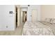 Bedroom with neutral color palette, featuring carpet and views of an adjacent bathroom at 2708 Norbeck St, Las Vegas, NV 89117
