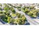 An aerial view of the community pond surrounded by landscaped streets and manicured trees at 2708 Norbeck St, Las Vegas, NV 89117