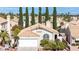 Attractive single-story home displaying a tile roof, two-car garage, and manicured front yard at 2708 Norbeck St, Las Vegas, NV 89117