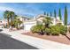 Lovely single-story residence showcasing a two-car garage, palms, and low-maintenance landscaping at 2708 Norbeck St, Las Vegas, NV 89117