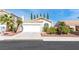 Beautiful single-story home boasting a tile roof, attached garage, and well-maintained landscaping at 2708 Norbeck St, Las Vegas, NV 89117