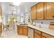 Kitchen boasts stainless steel appliances, white countertops, and wood cabinets at 2708 Norbeck St, Las Vegas, NV 89117
