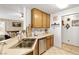 Kitchen features stainless steel appliances, white countertops and tile flooring at 2708 Norbeck St, Las Vegas, NV 89117