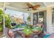Inviting outdoor dining area under covered patio, with elegant decor and furnishings at 2708 Norbeck St, Las Vegas, NV 89117