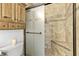 Updated shower featuring decorative glass door, seat, and tiled walls at 2708 Norbeck St, Las Vegas, NV 89117