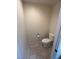Powder room with standard toilet, neutral walls and tiled floor at 3349 Partridge Run St, Laughlin, NV 89029
