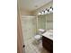 Bathroom with shower, dark vanity, and neutral colors at 3349 Partridge Run St, Laughlin, NV 89029