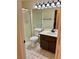 Bathroom featuring dark vanity, shower and neutral colors at 3349 Partridge Run St, Laughlin, NV 89029