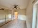 Bedroom featuring tile floors, mirrored closet, and neutral paint at 3349 Partridge Run St, Laughlin, NV 89029