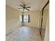 Bedroom featuring a ceiling fan, mirrored closet and window views at 3349 Partridge Run St, Laughlin, NV 89029
