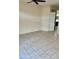 Spacious bedroom featuring neutral walls, tile floors, and a ceiling fan at 3349 Partridge Run St, Laughlin, NV 89029