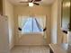 Bright dining area features tiled floors and a window view to the backyard at 3349 Partridge Run St, Laughlin, NV 89029