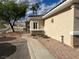 Beige house with a concrete walkway, desert landscaping, and mountain views at 3349 Partridge Run St, Laughlin, NV 89029