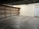 Spacious garage with ample shelving along the wall and cement flooring at 3349 Partridge Run St, Laughlin, NV 89029