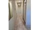 Hallway with tile flooring, neutral walls and storage at 3349 Partridge Run St, Laughlin, NV 89029