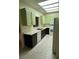 Kitchen with tile floors, white countertops, and bright green cabinets at 3349 Partridge Run St, Laughlin, NV 89029