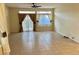 Light-filled living room boasts tile flooring, lots of space, and backyard views at 3349 Partridge Run St, Laughlin, NV 89029