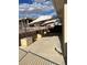 This patio features multiple umbrellas for shade, and rock landscaping at 3349 Partridge Run St, Laughlin, NV 89029