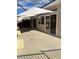 The large concrete patio has an awning and sliding glass doors to the home at 3349 Partridge Run St, Laughlin, NV 89029