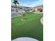 Lush backyard putting green provides golfers a place to hone their skills at 3349 Partridge Run St, Laughlin, NV 89029