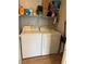 Laundry area featuring modern appliances and built in shelving at 3400 Denali Preserve St, Las Vegas, NV 89122