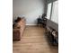 Living room with natural light, a desk, and wooden-look floors at 3400 Denali Preserve St, Las Vegas, NV 89122