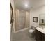 Bright bathroom featuring a tub with shower and vanity with framed artwork at 3534 Alpheus River Ave, Las Vegas, NV 89106