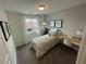 Bright bedroom with large window, patterned wallpaper and desk at 3534 Alpheus River Ave, Las Vegas, NV 89106