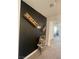 Hallway with stylish black accent wall and decorative wooden clothespin art at 3534 Alpheus River Ave, Las Vegas, NV 89106