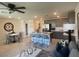Bright open-concept living area featuring a modern kitchen, breakfast bar, and stylish decor at 3534 Alpheus River Ave, Las Vegas, NV 89106