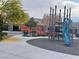 Community playground with a blue slide and climbing structure near homes under construction at 3534 Alpheus River Ave, Las Vegas, NV 89106