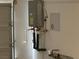A tankless water heater is mounted on the garage wall at 3534 Alpheus River Ave, Las Vegas, NV 89106