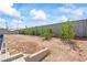 Backyard space with trees and cinder block fence ready for landscaping at 3661 Margarita Way, Las Vegas, NV 89103