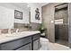 Updated bathroom featuring a modern vanity, tiled shower, and stylish decor at 3661 Margarita Way, Las Vegas, NV 89103