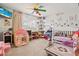 Playful bedroom with fun ceiling fan, entertainment center, and ample storage at 3661 Margarita Way, Las Vegas, NV 89103