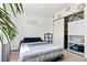 Cozy bedroom featuring neutral tones, comfortable bedding, and closet with sliding doors at 3661 Margarita Way, Las Vegas, NV 89103