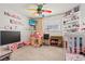 Playful bedroom with fun ceiling fan, entertainment center, and ample storage at 3661 Margarita Way, Las Vegas, NV 89103