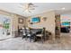 Cozy dining area features a dark wood table set and view of backyard with in-ground pool at 3661 Margarita Way, Las Vegas, NV 89103