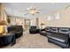 Spacious living room with a ceiling fan, plush seating, and neutral decor at 3661 Margarita Way, Las Vegas, NV 89103