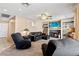 Comfortable living room featuring carpet, a ceiling fan, and a fireplace at 3661 Margarita Way, Las Vegas, NV 89103