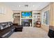 Comfortable living room with built-in shelving, a fireplace, and a plush couch at 3661 Margarita Way, Las Vegas, NV 89103