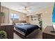 Cozy main bedroom featuring a ceiling fan, built-in shelves, and plush bedding at 3661 Margarita Way, Las Vegas, NV 89103