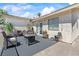 Relaxing covered patio area with seating, decor, and outdoor carpeting at 3661 Margarita Way, Las Vegas, NV 89103