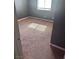 Cozy bedroom with a window and carpet, bathed in natural light for a peaceful atmosphere at 3750 S Rainbow Ave, Pahrump, NV 89048