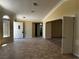 Tiled living room with large windows and neutral colors, offering a bright and welcoming atmosphere at 3750 S Rainbow Ave, Pahrump, NV 89048