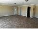 Spacious living room with tiled floors and modern lighting at 3750 S Rainbow Ave, Pahrump, NV 89048