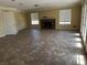 Open-concept living room with a fireplace and large windows at 3750 S Rainbow Ave, Pahrump, NV 89048