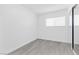 Bright bedroom with mirrored closet doors and gray floors at 3805 San Angelo Ave, Las Vegas, NV 89102